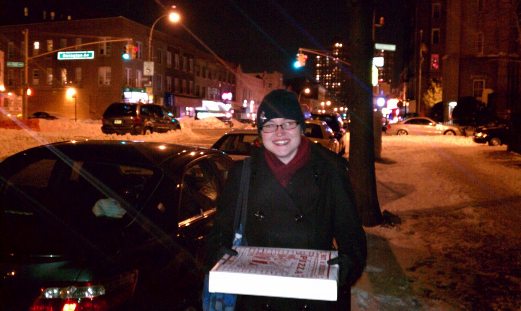 I'd rather be holding this box of pizza than stuck in that stranded minivan!